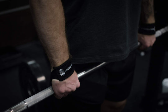 Set of two Gymreapers weightlifting wrist straps in black, enhancing your lifting performance during workouts.