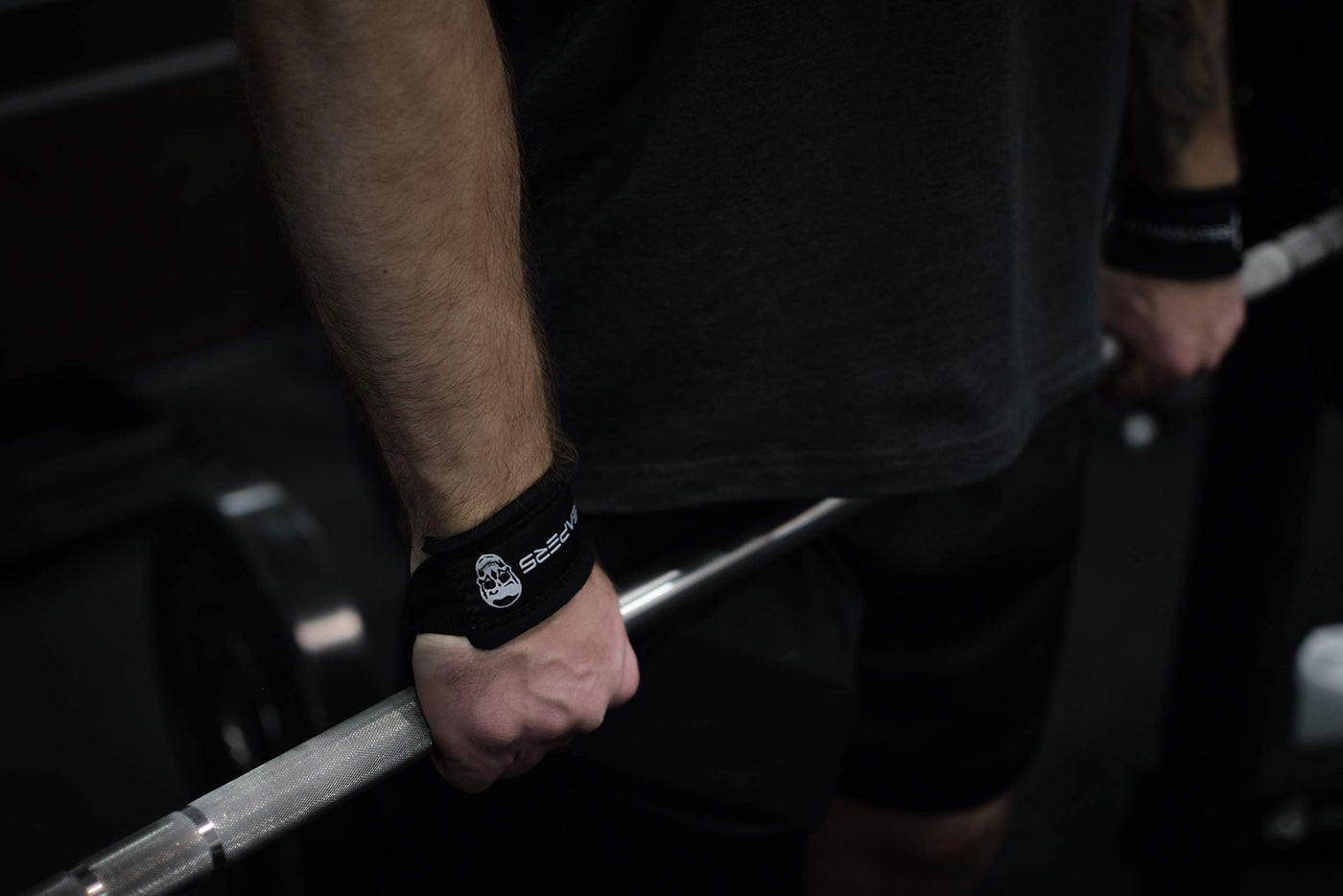 Set of two Gymreapers weightlifting wrist straps in black, enhancing your lifting performance during workouts.