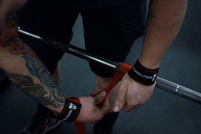 Athlete showcasing the comfort and support of Gymreapers weightlifting wrist straps during a training session.