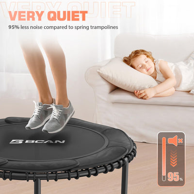 User demonstrating balance and coordination on the BCAN fitness trampoline with handle during active play.