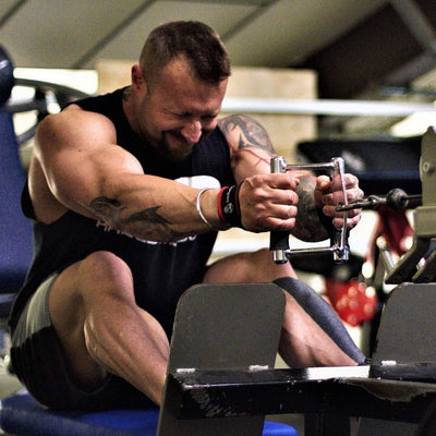 Tight grip of Gymreapers lifting wrist straps optimally supporting athletes during strenuous workouts.