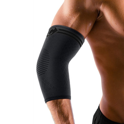 Person stretching while wearing CAMBIVO elbow brace for tendonitis, showing flexibility.