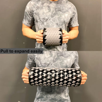 The collapsible foam roller positioned outdoors, emphasizing its lightweight and portable features, perfect for on-the-go workouts.