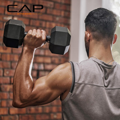 User utilizing hex dumbbells with rack from CAP Barbell for strength training.